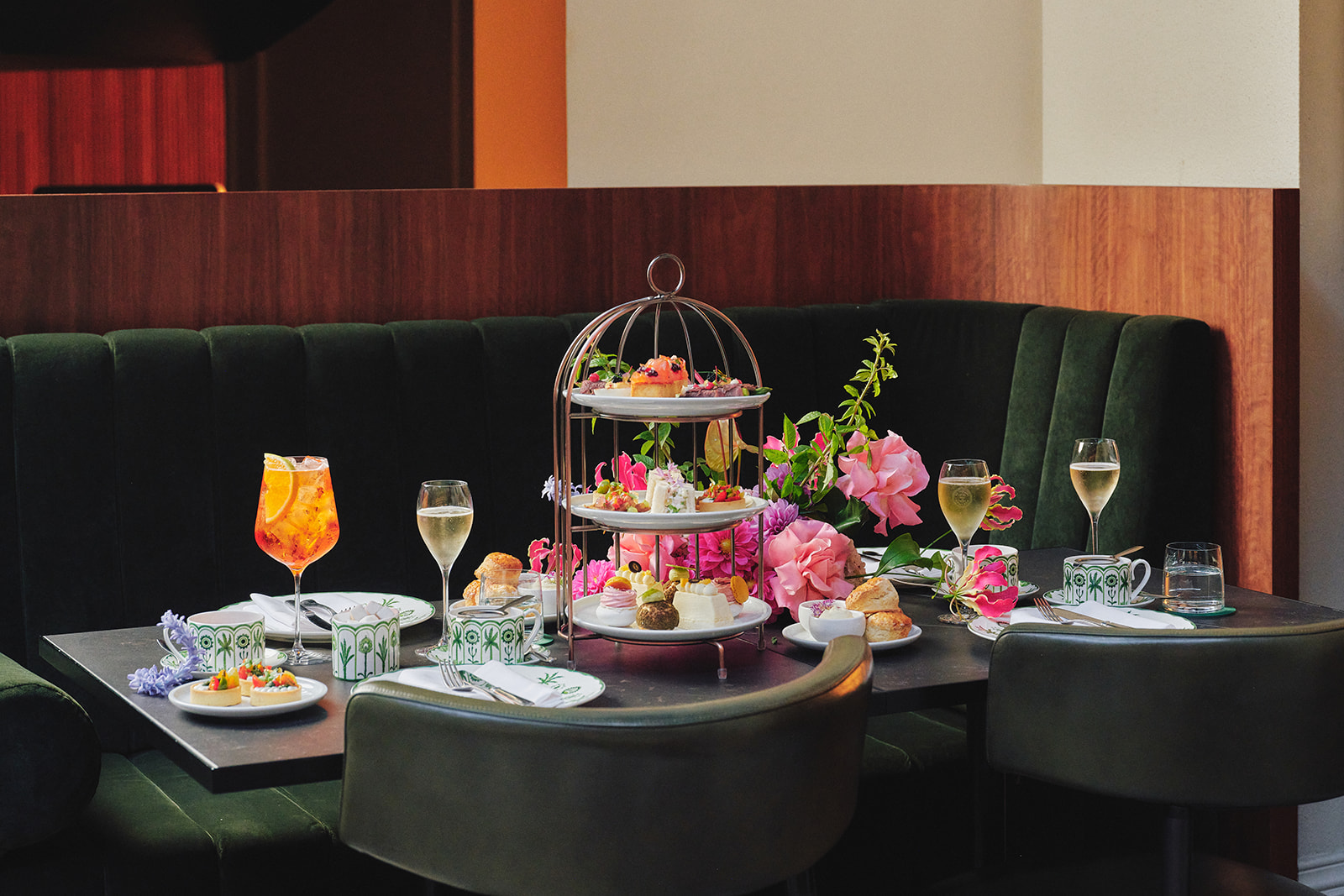 High tea spread at The Treasury, InterContinental Sydney — native botanical pastries, finger sandwiches, and tiered stands with handcrafted sweets